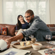 The turning gesture essentially lets the speaker function as its own remote control.